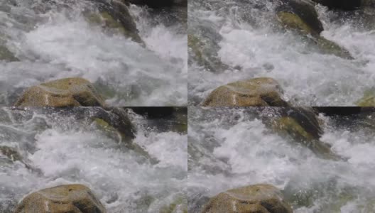 湍急的水流在缓慢的运动，高山河流的近景高清在线视频素材下载