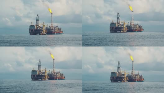 靠近钻井平台的FPSO油轮。海上石油和天然气工业高清在线视频素材下载