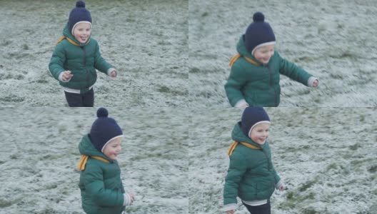 快乐的孩子在冬天的第一场雪上奔跑高清在线视频素材下载