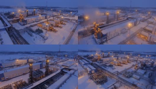 鸟瞰图明亮的燃气厂领土在冬夜高清在线视频素材下载