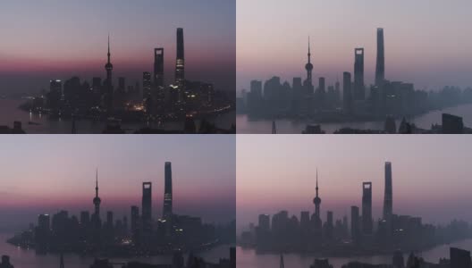 T/L PAN无人机在黎明俯瞰上海天际线，从夜晚到白天/上海，中国高清在线视频素材下载