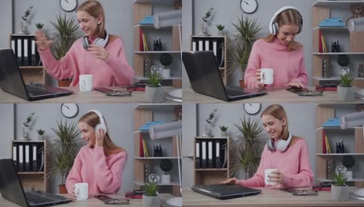 穿着针织毛衣的可爱快乐的年轻女子走到桌边，打开笔记本电脑，戴上耳机，享受着美妙的音乐高清在线视频素材下载
