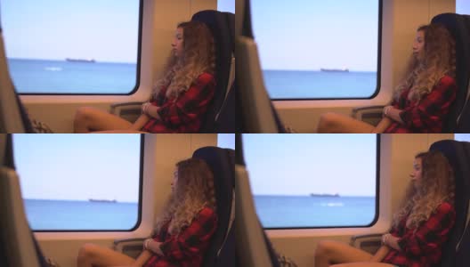 穿着格子衬衫的时尚女士坐在火车座位上高清在线视频素材下载