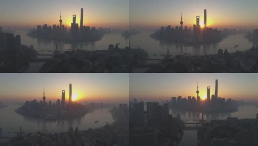 阳光明媚的早晨，上海的天际线。陆家嘴区和黄浦江。中国高空鸟瞰图。无人机是向上和横向飞行。远景高清在线视频素材下载