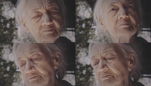 近距离观看沉思中的老妇人的肖像。系列。高清在线视频素材下载