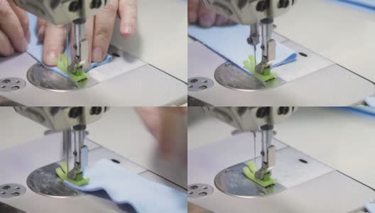 一个裁缝的手在缝纫机上缝制衣服的细节。工作室。特写镜头高清在线视频素材下载