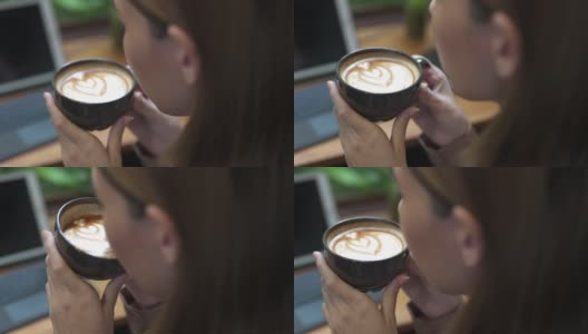 4K亚洲女商人在咖啡店喝拿铁咖啡。高清在线视频素材下载