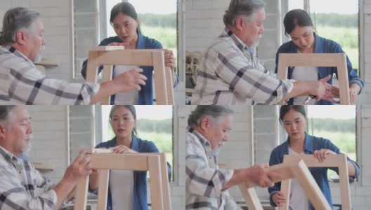 工人木匠老人70岁和十几岁的女孩一起在工厂制作木制家具。工厂和制造概念。高清在线视频素材下载
