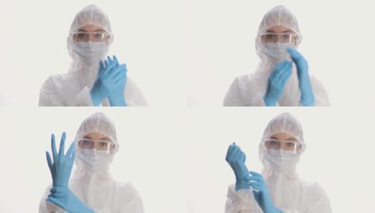白色背景上穿着防护服、面具、手套和眼镜的女人的肖像。冠状病毒大流行隔离。COVID-19流行病。怕感染高清在线视频素材下载