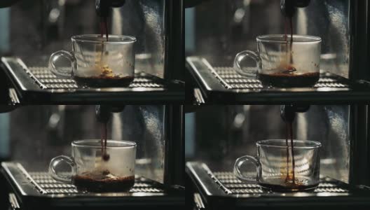 咖啡馆咖啡厅的咖啡机准备浓缩咖啡的慢镜头，咖啡师用无底过滤器从专业机器中提取咖啡。高清在线视频素材下载