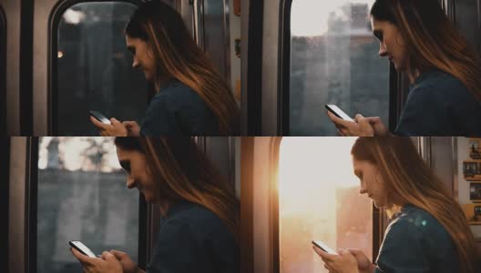 年轻快乐的女人在美国芝加哥乘坐地铁的肖像。微笑的女性在日落使用智能手机高清在线视频素材下载