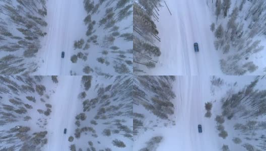 空中俯瞰:汽车行驶在积雪的道路上，穿过寒冷的冬季云杉森林高清在线视频素材下载