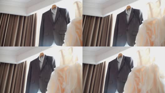 挂在窗前的婚纱和西服高清在线视频素材下载