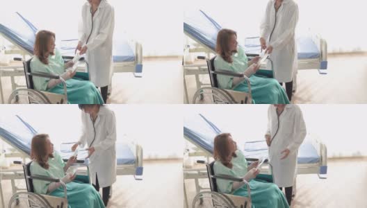 残疾妇女坐在轮椅工作和使用数字平板电脑在医院高清在线视频素材下载