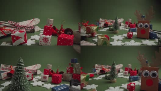 用手工制作的驯鹿、礼品盒和塑料雪花制成的圣诞和新年装饰品高清在线视频素材下载