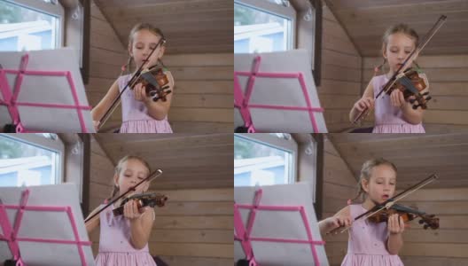 小女孩在家拉小提琴，唱歌高清在线视频素材下载