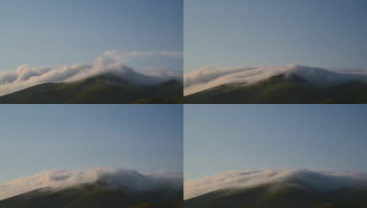 美丽的云朵缓缓飘过群山。高清在线视频素材下载