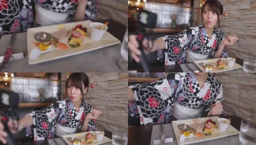 一名日本女子在法国餐厅吃午餐拍视频高清在线视频素材下载