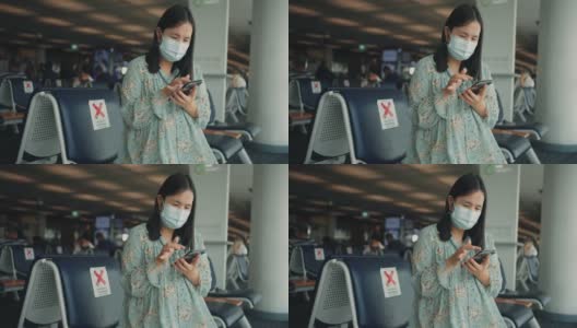 女旅客在机场候机时使用手机。高清在线视频素材下载