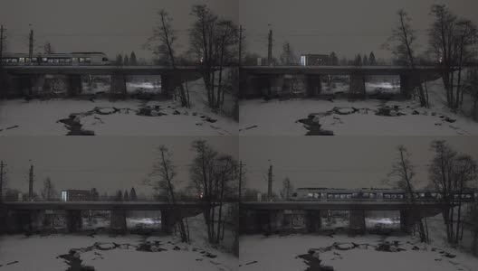 冬季城市的旅客列车在大桥上运行的夜景高清在线视频素材下载