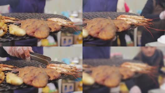 地中海式饮食。街头厨师把烤虾放凉高清在线视频素材下载