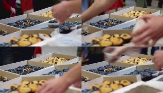 面包店摊贩在自制的食品交易会上出售美味的蛋糕，糖果高清在线视频素材下载