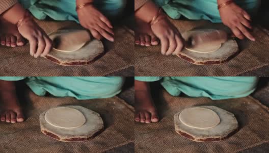 印度妇女在传统炉子上做饭(chulha)高清在线视频素材下载