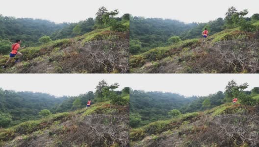 在热带森林的山坡上跑步的女人高清在线视频素材下载