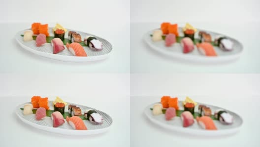 各种日本手握寿司传统食物的白色盘子高清在线视频素材下载