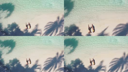一对夫妇在马尔代夫享受热带海滩高清在线视频素材下载