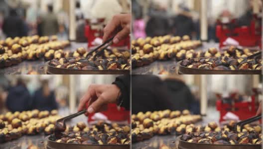 伊斯坦布尔烤栗子市场小贩准备视频。栗树，伊斯坦布尔，街道，烘焙，拥挤高清在线视频素材下载