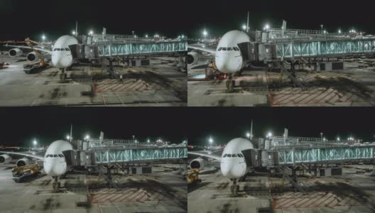 4k分辨率商业飞机与旅客站在机场候机楼门口的夜景高清在线视频素材下载