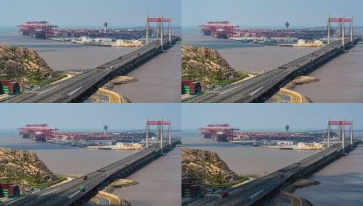 4K时间推移:鸟瞰图工业港口与货轮和集装箱卡车在桥上。高清在线视频素材下载