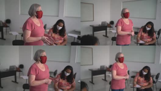 老师在课堂前给学生上课——戴口罩高清在线视频素材下载