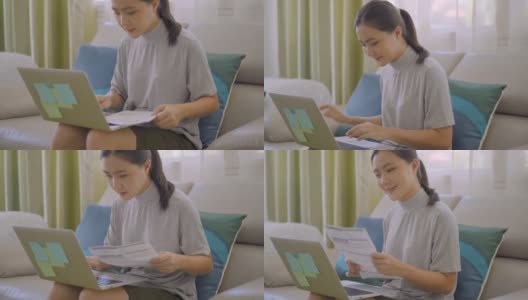 亚洲女性在家里用笔记本电脑付账高清在线视频素材下载