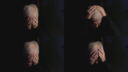 一个抑郁的老人独自在黑暗中高清在线视频素材下载