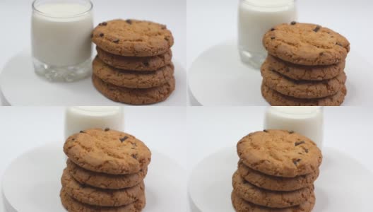 香甜的自制饼干与巧克力片隔离在背景上，悬浮的糖果和烘焙概念高清在线视频素材下载