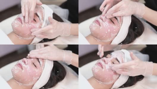 美容师在美容院为年轻的亚洲妇女做皮肤护理程序高清在线视频素材下载