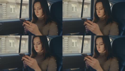 女性在车内使用手机短信滚动浏览互联网搜索新闻高清在线视频素材下载