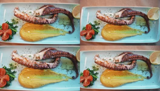 希腊:配上配料和蔬菜的烤章鱼高清在线视频素材下载