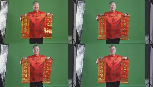 穿着红色普通话的亚洲老人新年快乐4k高清在线视频素材下载