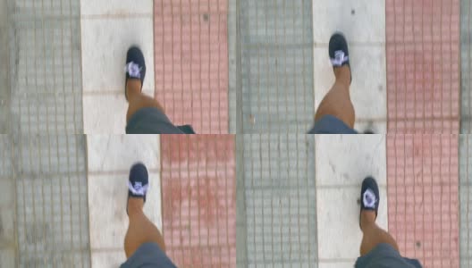 穿着运动鞋的男人走在街上高清在线视频素材下载