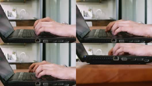 摄影:商人在笔记本电脑键盘上打字高清在线视频素材下载