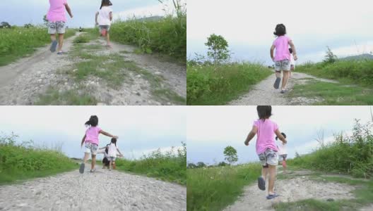 两个小女孩跑向她们的母亲给一个拥抱在一起的背影高清在线视频素材下载