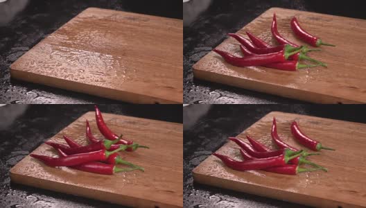 红辣椒落在木头上。Slowmotion高清在线视频素材下载