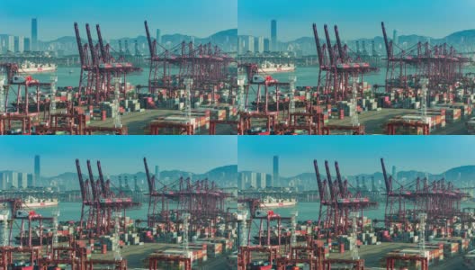 4K时间推移:码头商业港口和吊车桥装载集装箱到集装箱船与香港城市景观背景。高清在线视频素材下载