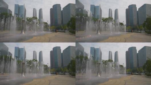 白天时间成都市中心著名的写字楼商场喷泉广场全景4k中国高清在线视频素材下载