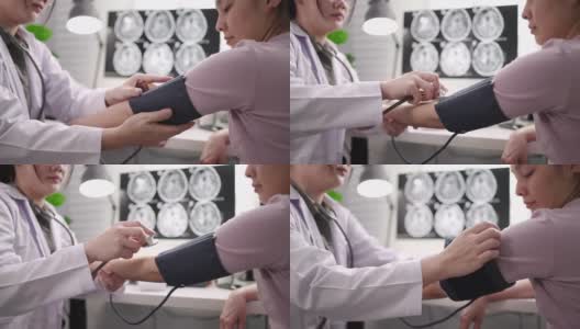 近距离医疗检查，医生使用血压计和听诊器测量血压高清在线视频素材下载
