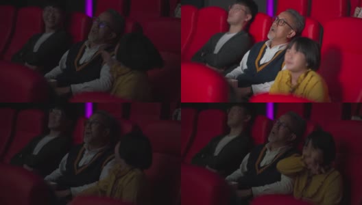 一位亚裔中国老人和他的孙女在电影院看电影睡着了高清在线视频素材下载