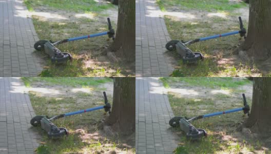 Scooter被遗弃在草地上，4k慢镜头，每秒60帧高清在线视频素材下载